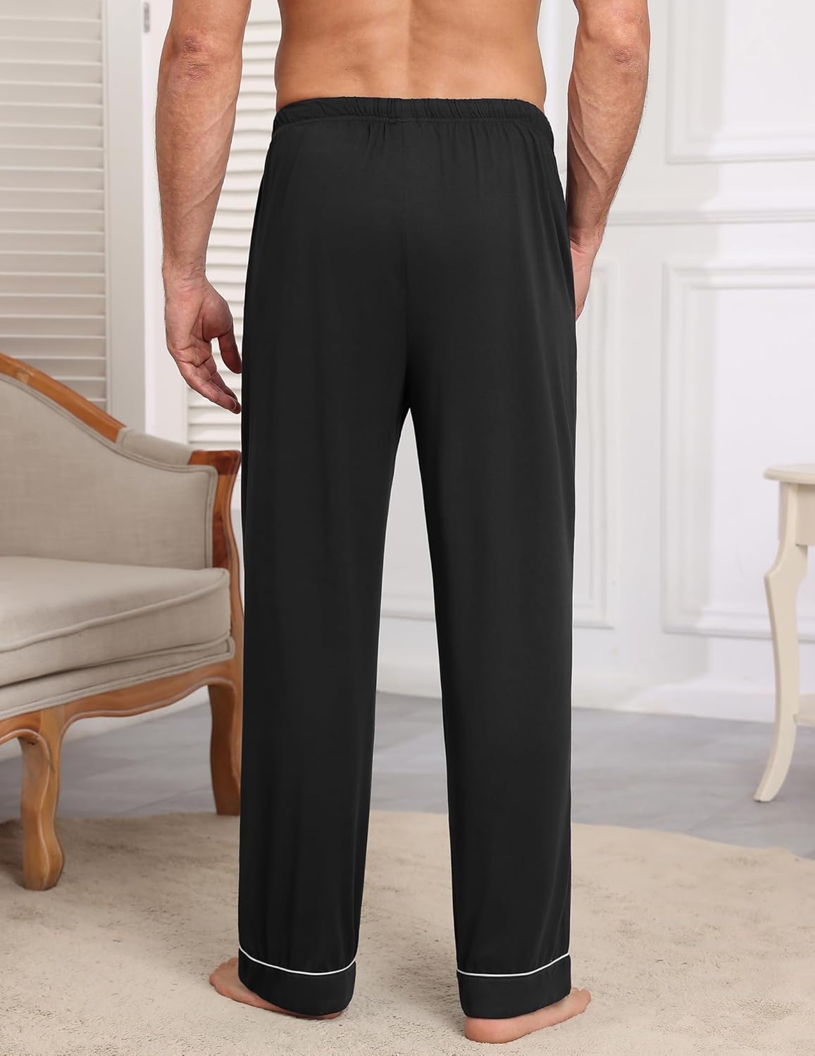 Black pajama pants with elastic waistband and contrast-trim ankle cuffs