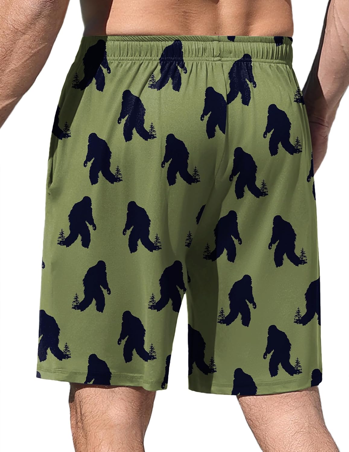 Army green pajama shorts with navy dinosaur silhouettes and elastic waist
