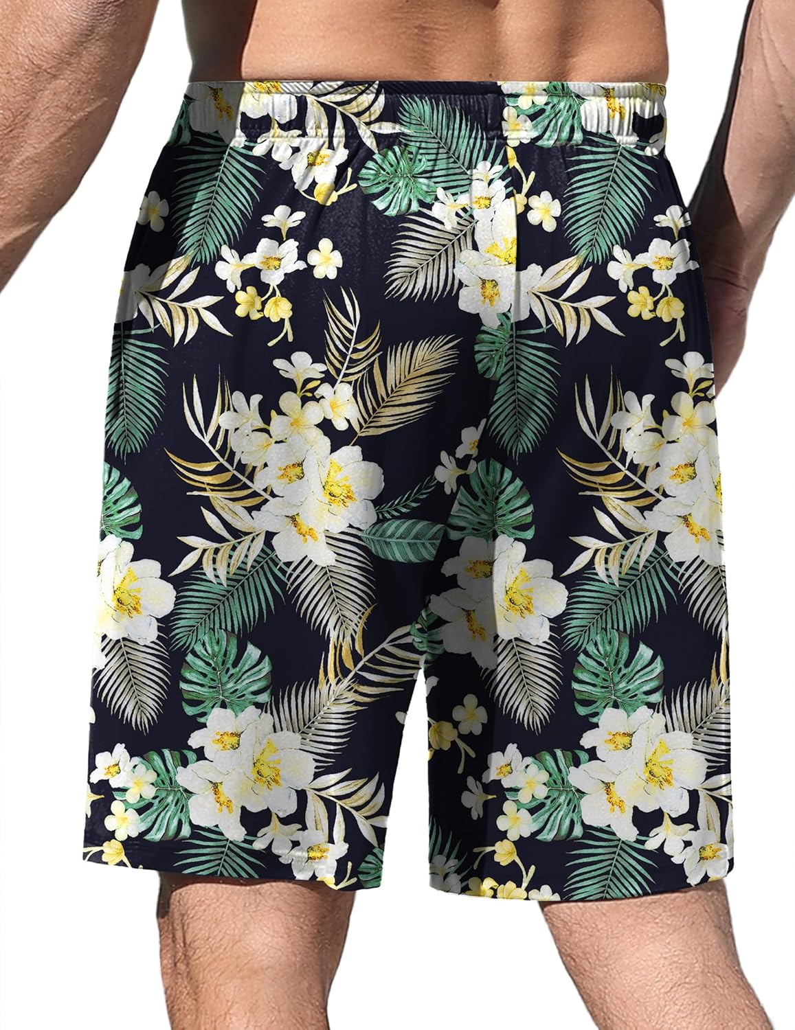 Black pajama shorts with white flowers and green palm leaf pattern