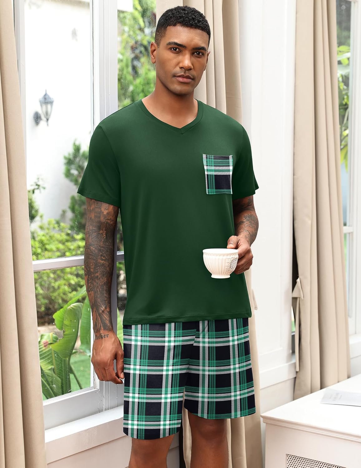 Deep green V-neck pajama set with pocket detail and green plaid shorts