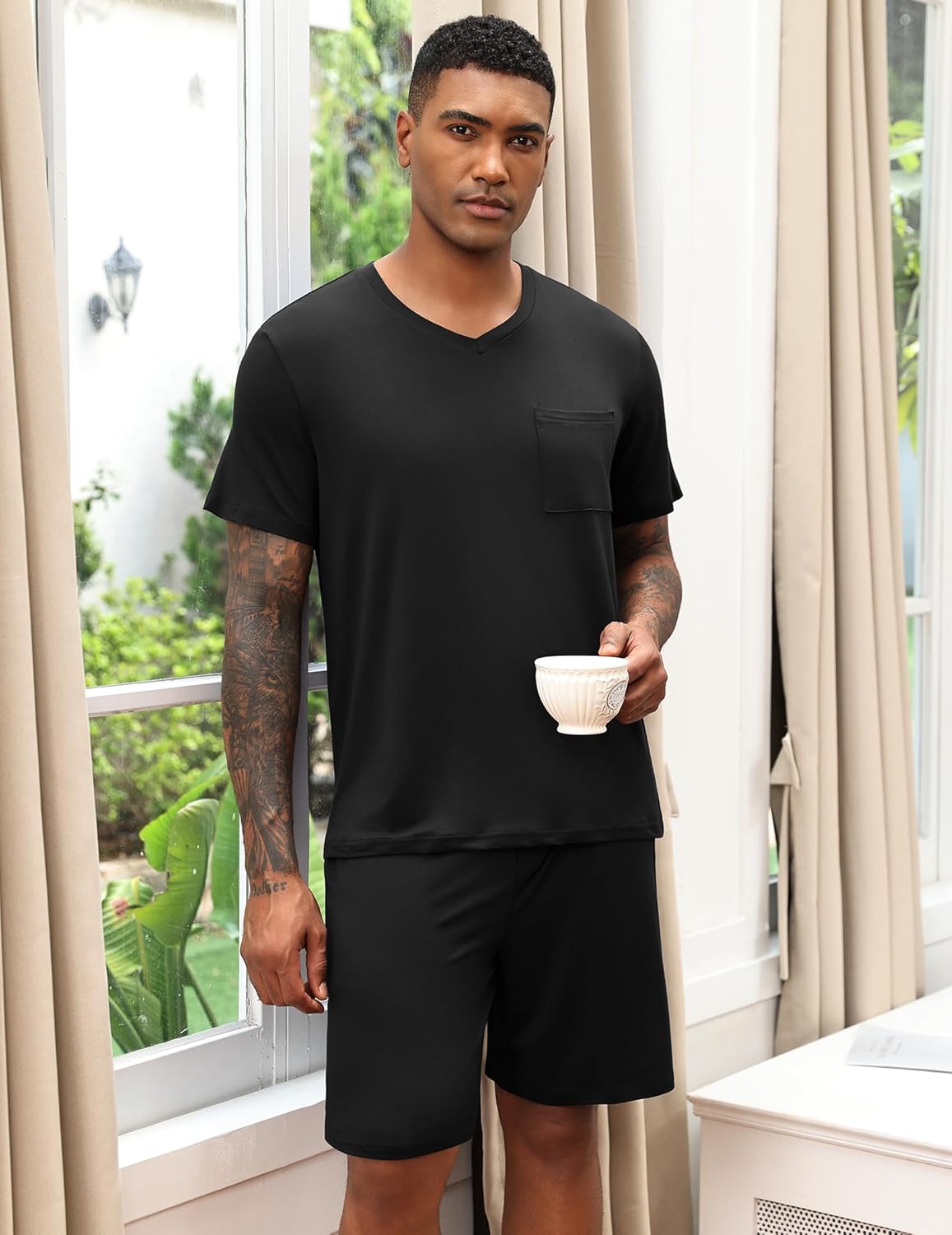 Black V-neck pajama set with chest pocket and solid black shorts