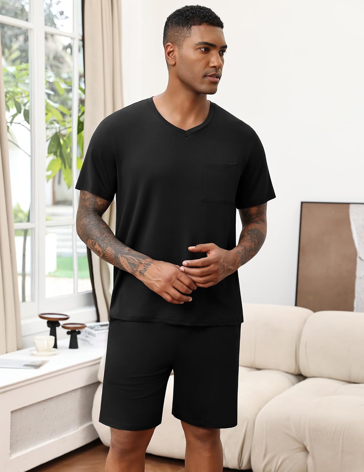 Black V-neck pajama set with chest pocket and solid black shorts