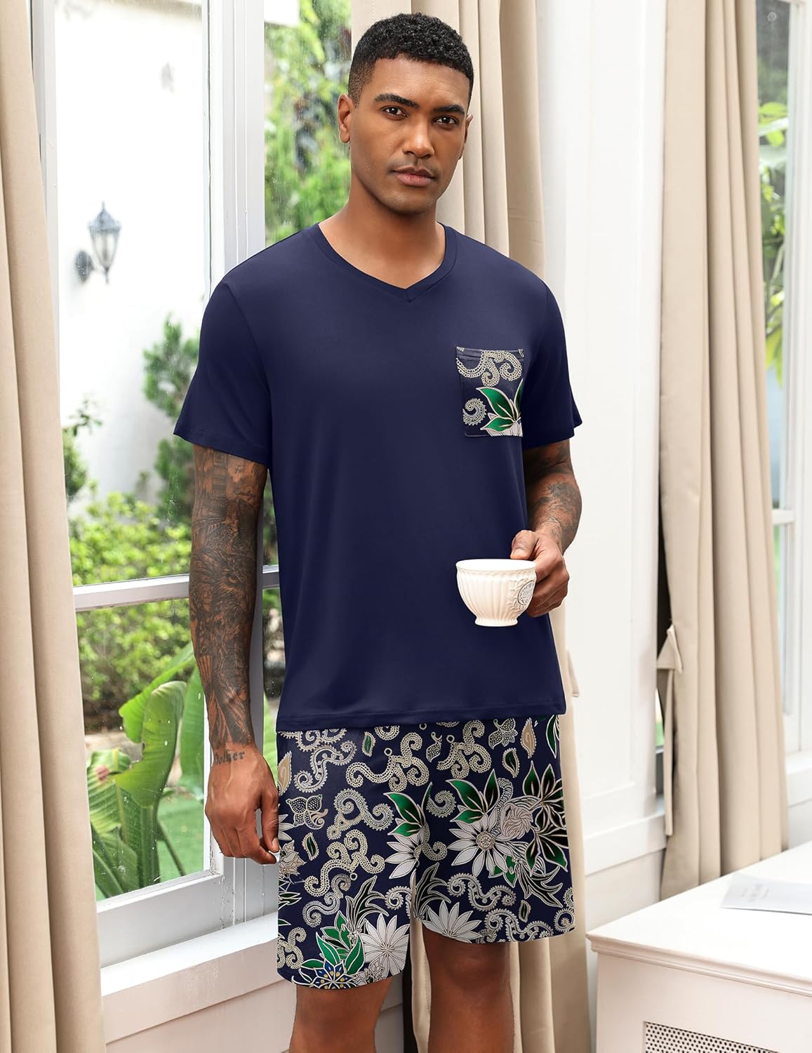 Men's V-neck pajama set in navy with floral shorts and chest pocket.