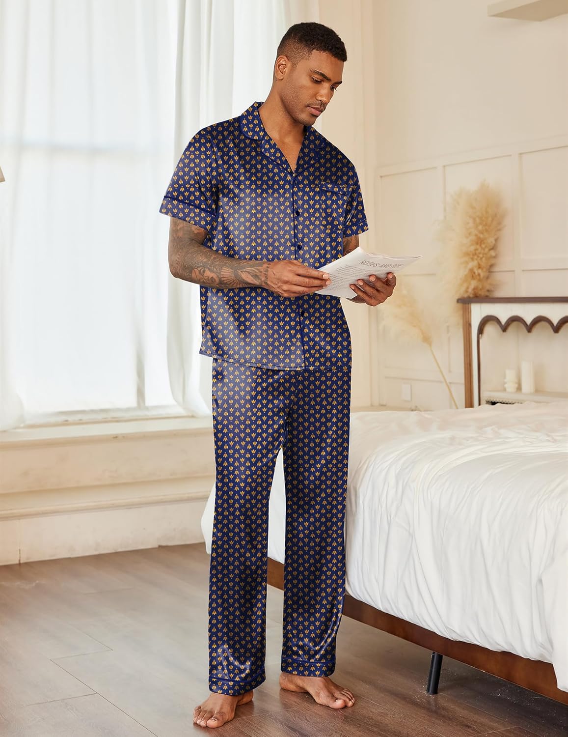 Men’s satin pajama set in dark blue with allover pattern: button-up shirt and long pants