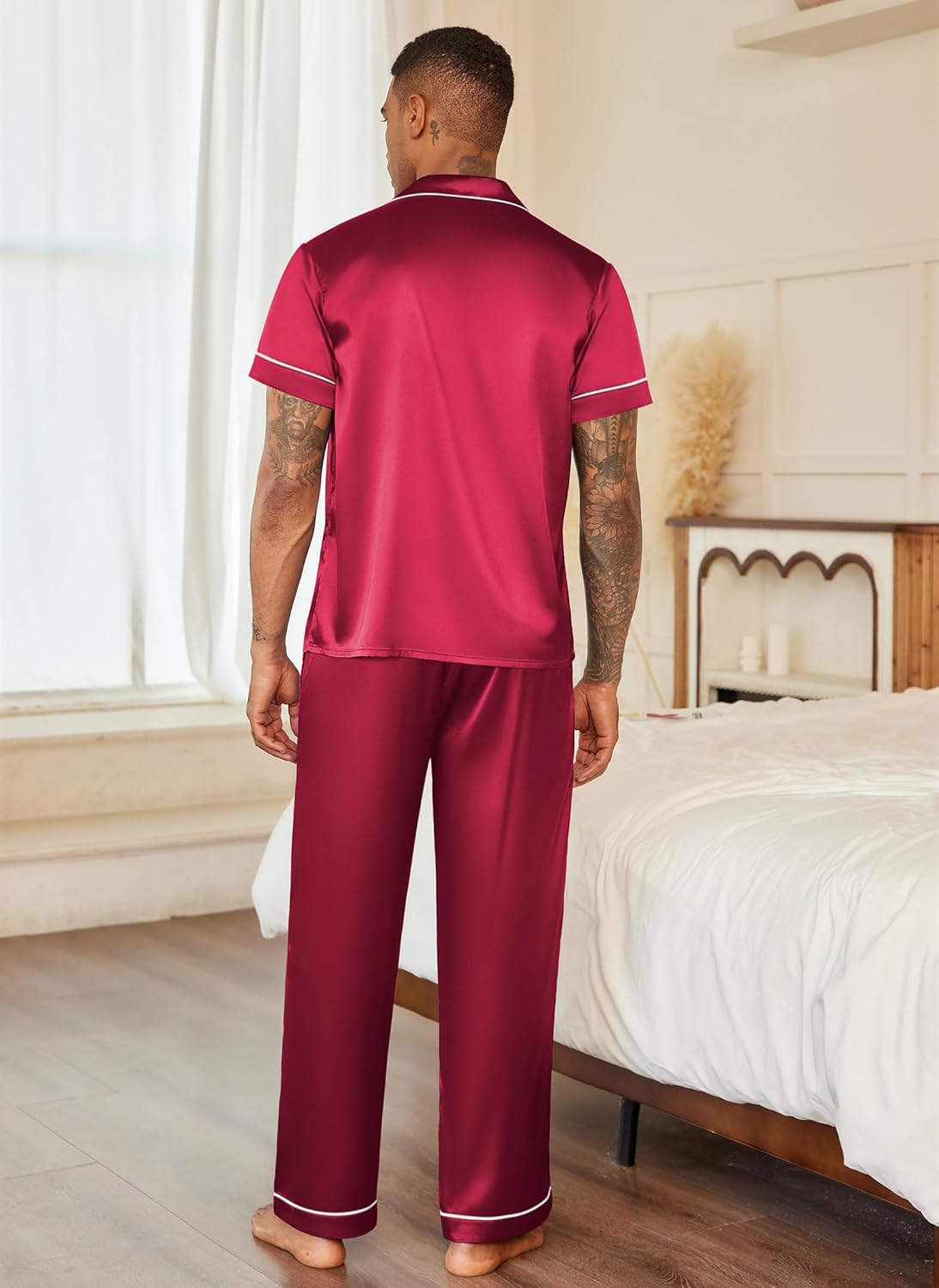 Men’s satin pajama set in red from the back: short-sleeve button-up and long pants
