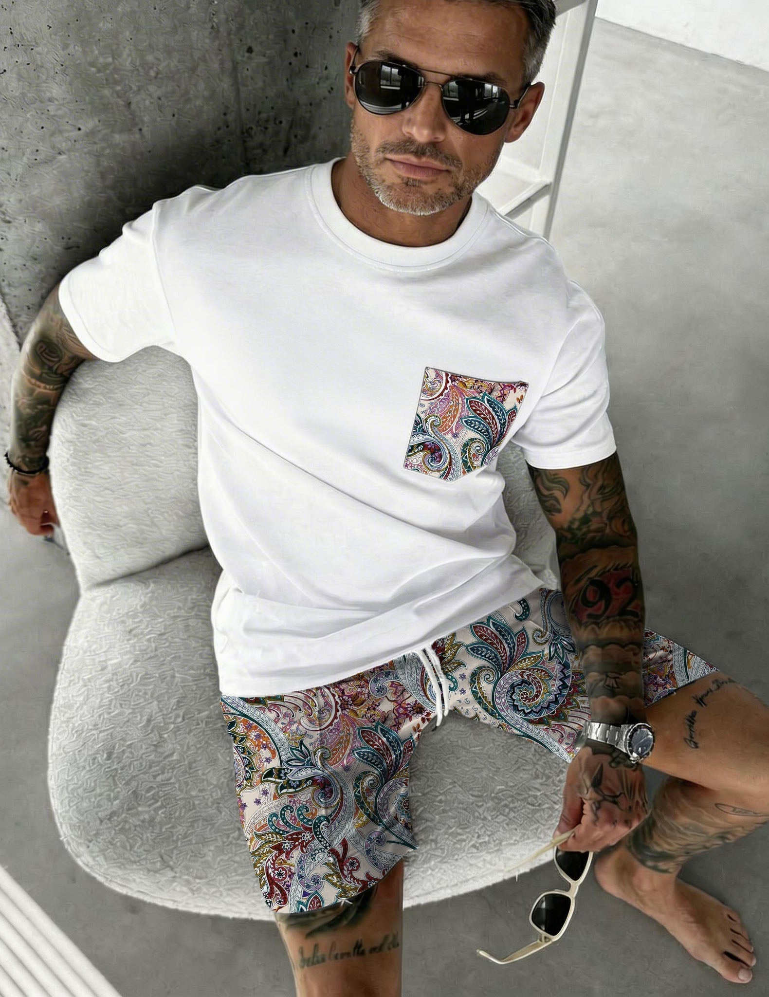 Men's white paisley pocket tee and shorts set, multicolor print