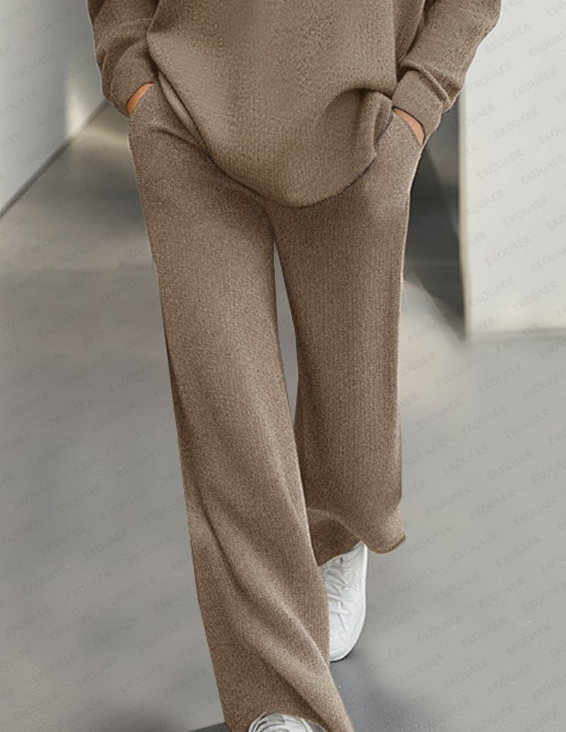 Khaki knit jogger pants with white sneakers peeking, matching turtleneck top