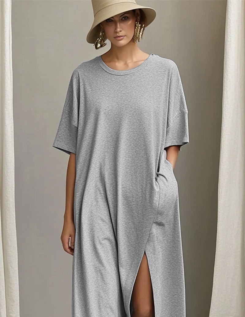 Light gray maxi dress with crew neck, short sleeves, side slit and pocket detail