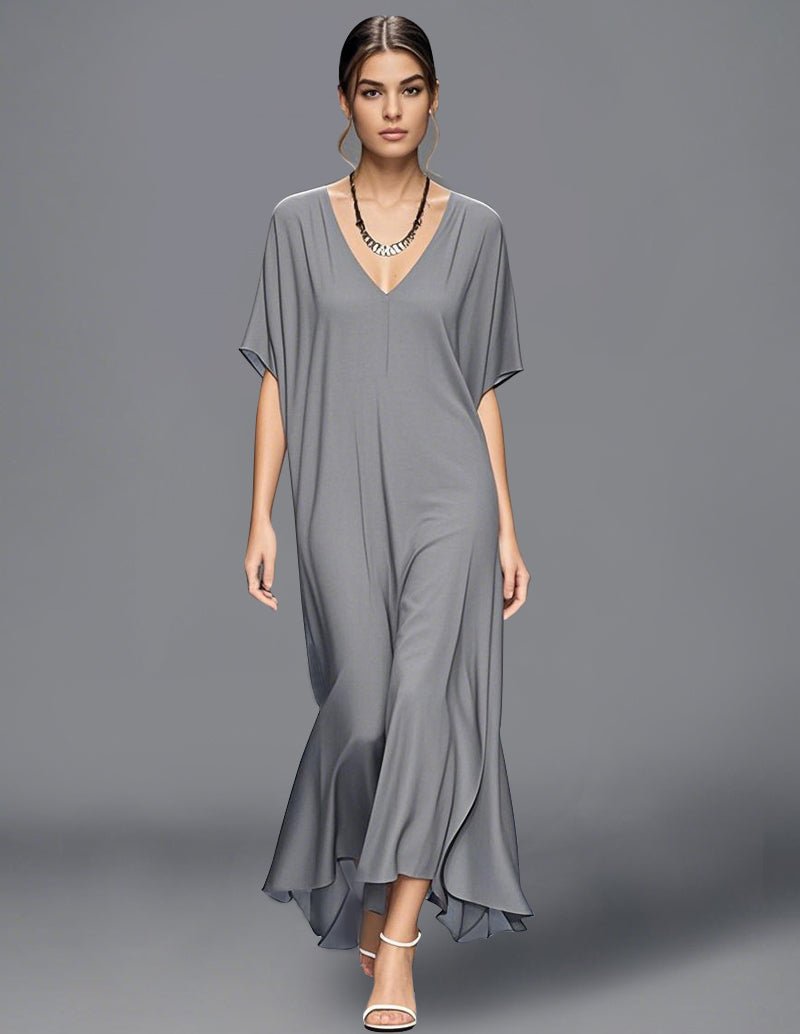 Gray minimalist flowy maxi dress with V-neck, short cape sleeves, draped asym hem