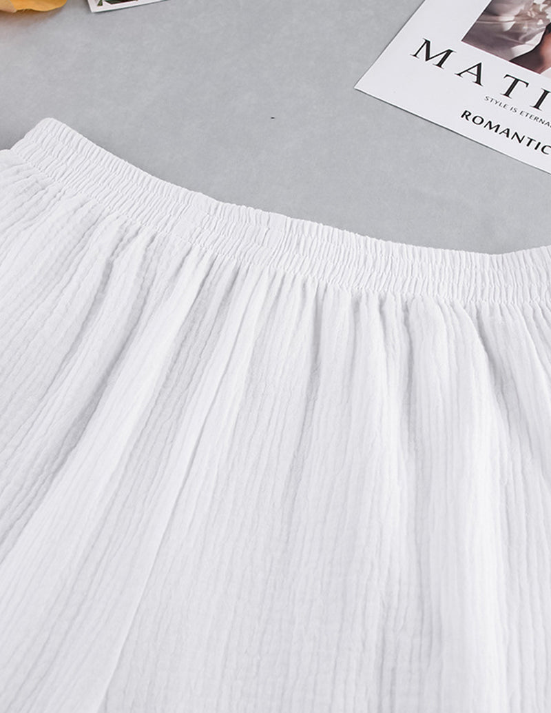White cotton lounge set shorts with elastic waistband and crinkled fabric