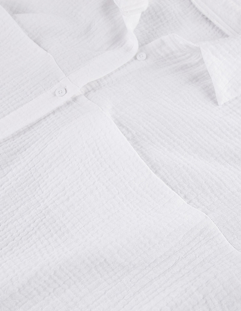 White cotton lounge shirt button placket with small round buttons