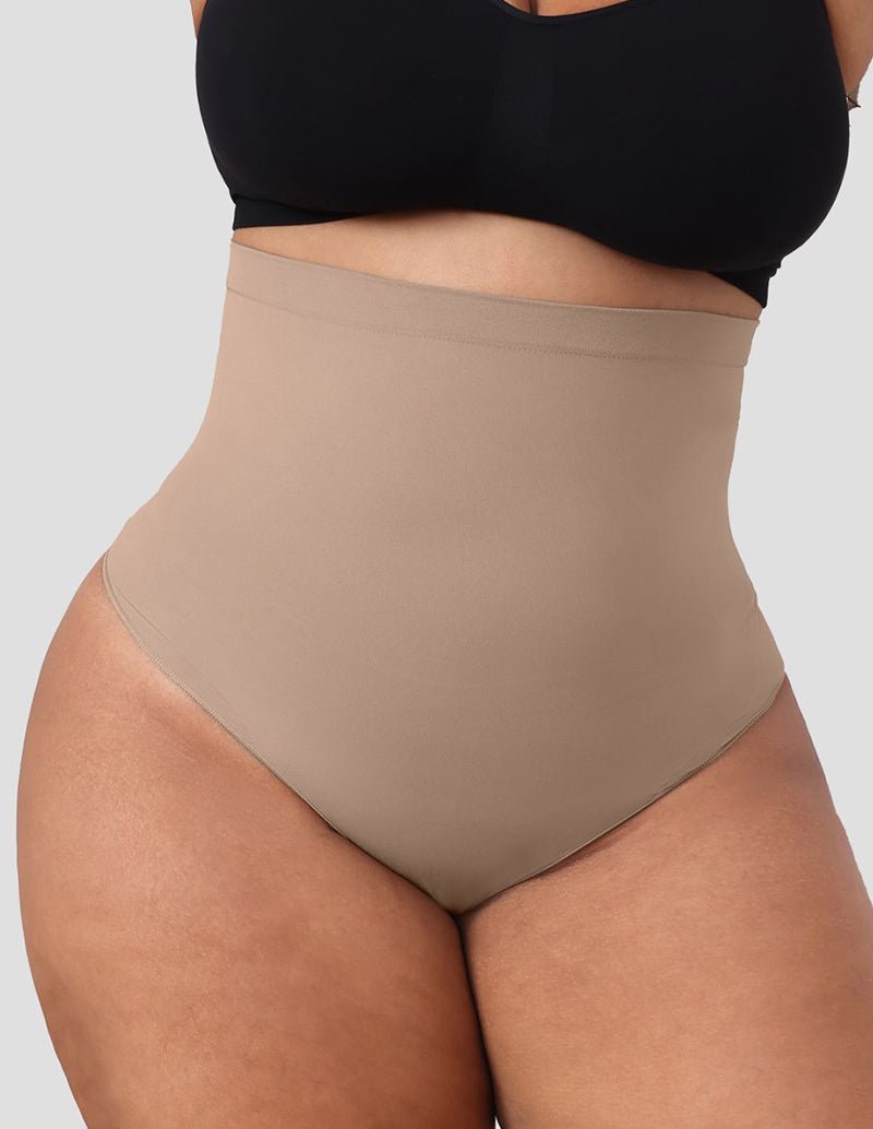 Beige high-waist tummy control shapewear brief on model, full coverage