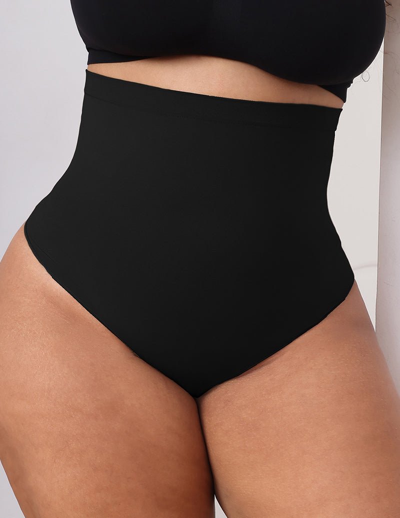 Black high-waist tummy control shapewear brief on model, smooth full coverage