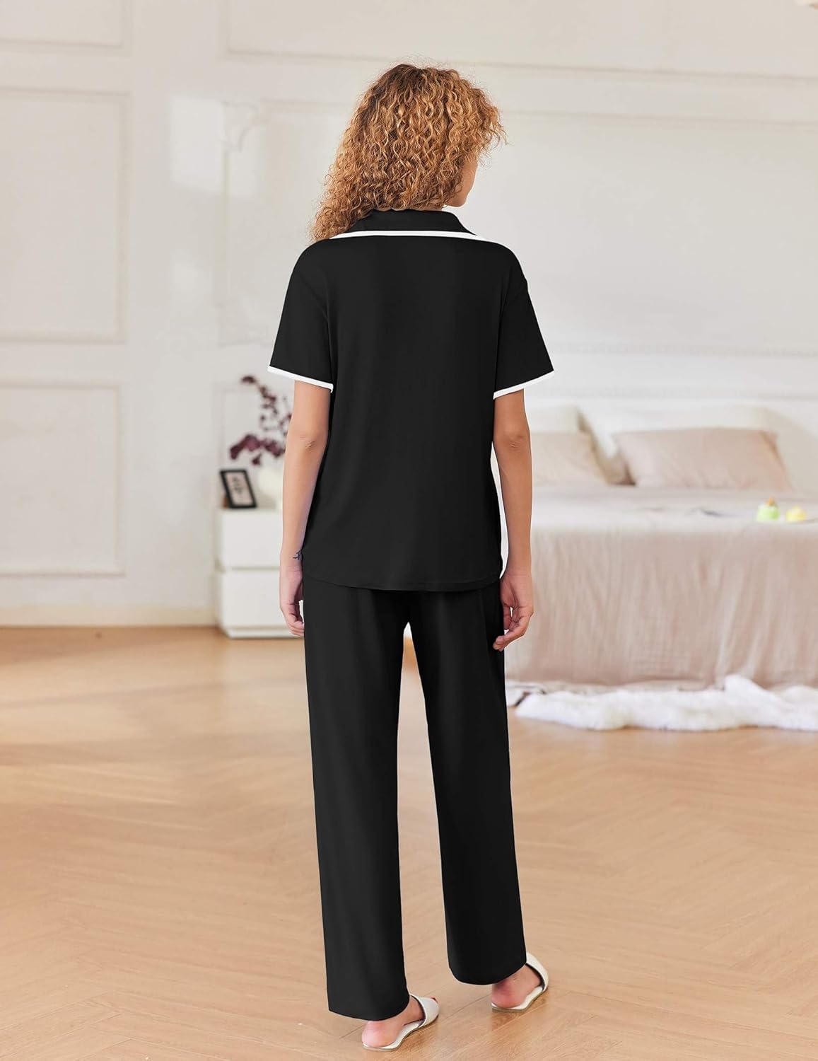 Black short-sleeve lounge pajama set, back view with matching long pants