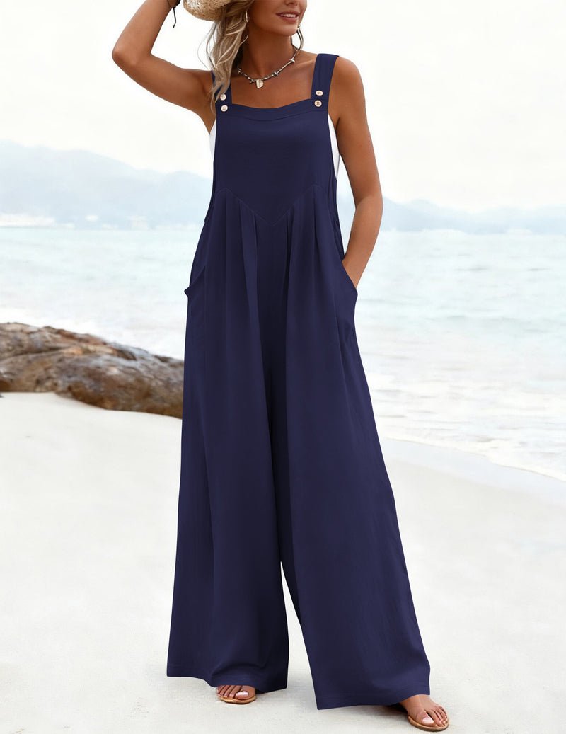 Dunkelblauer Jumpsuit mit Trägern, weiten Hosenbeinen und sanft fallenden Falten