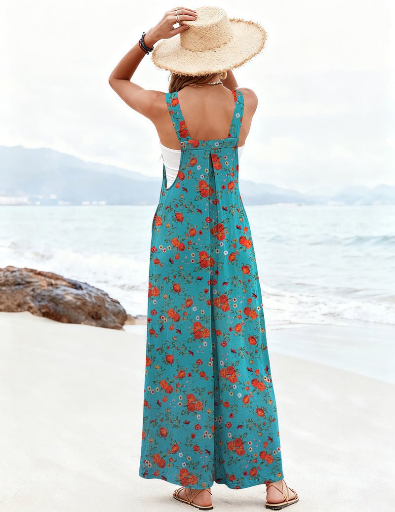 Back view: teal blue floral wide-leg jumpsuit with open back and thin straps