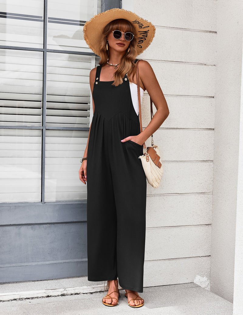 Black wide-leg jumpsuit with button strap detail and relaxed gathered bodice