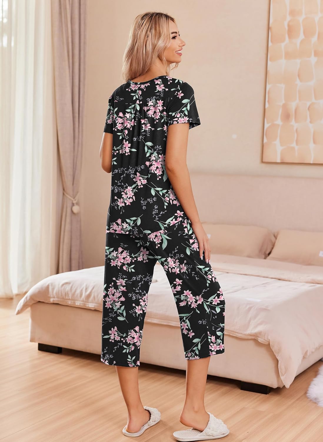 Black floral pajama set with short-sleeve button-up top and capri pants
