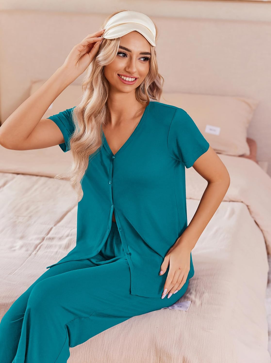Teal green button-up pajama set with matching capri pants, short sleeves, close-up