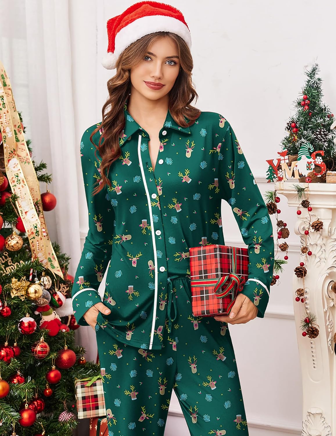 Green holiday pajama set with long sleeves, button front, and reindeer print