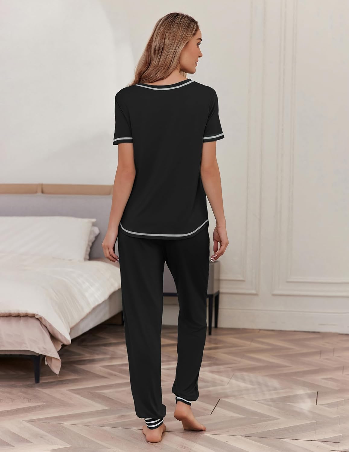 Black short-sleeve pajama set, back view: T-shirt and cuffed pants with contrast trim