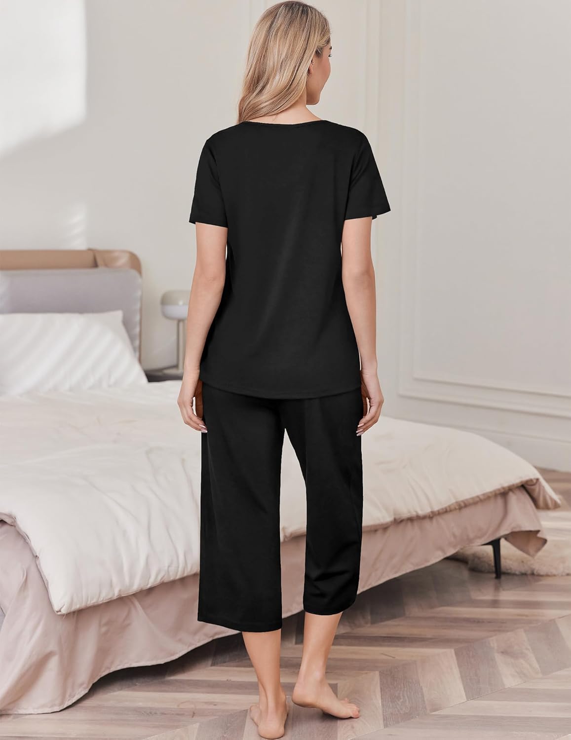 Women's cotton pajama set with solid black top and capri pants (back view)