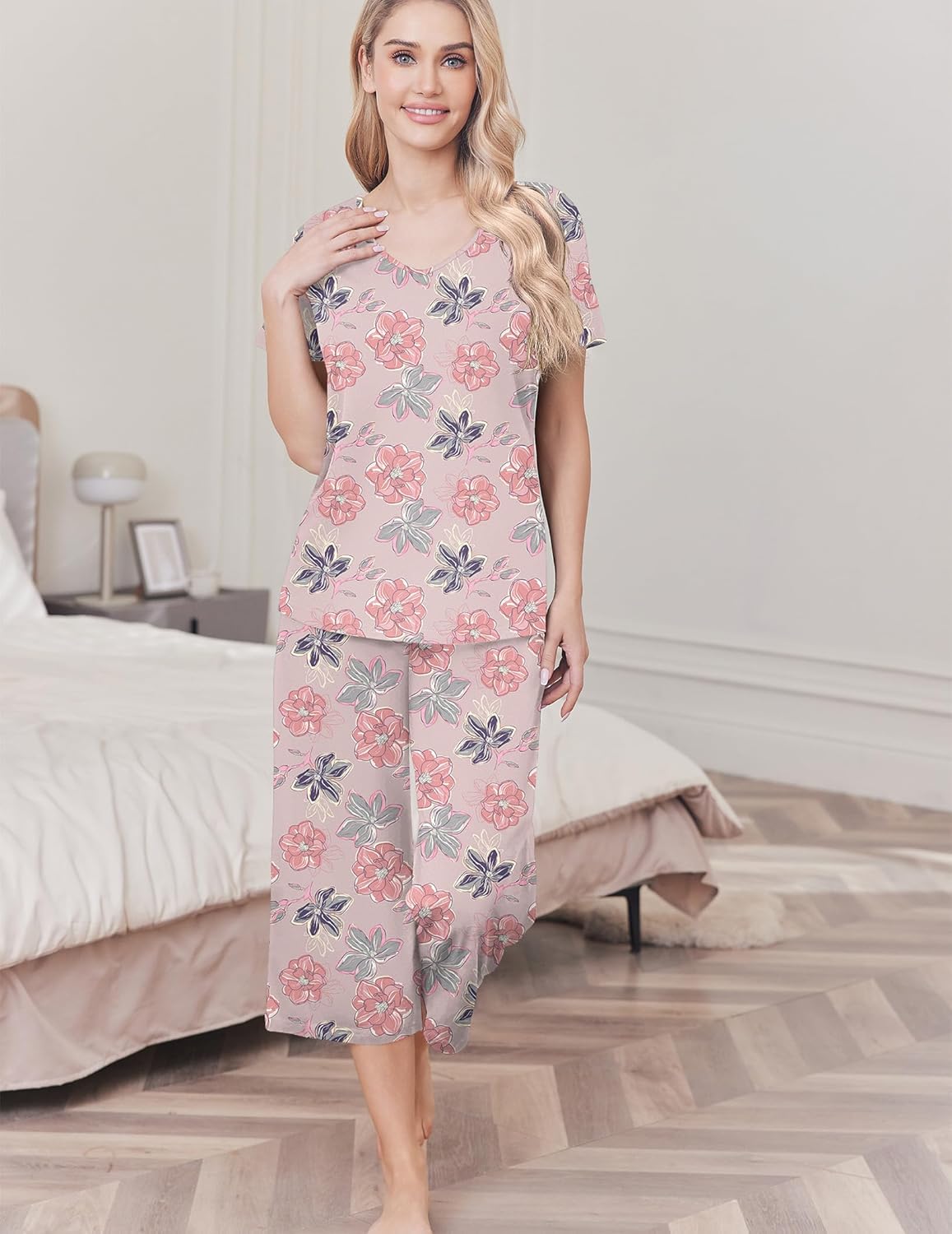 Women's cotton pajama set with pink top and capri pants, floral print with gray details