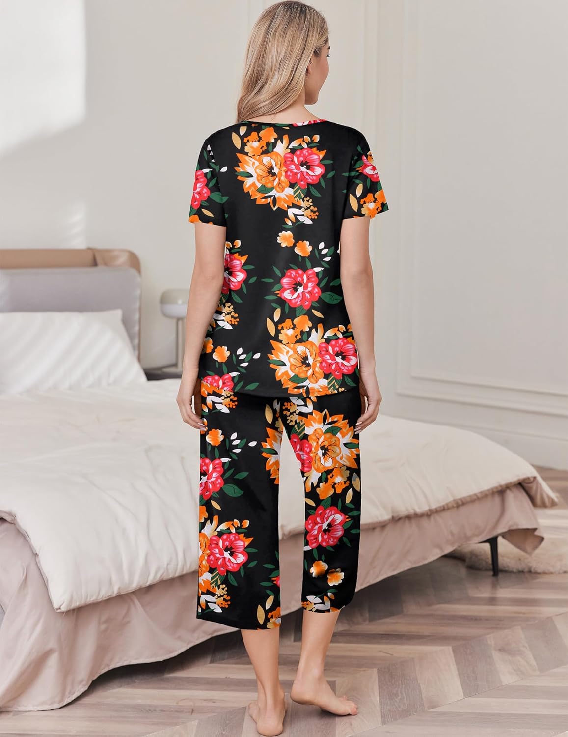 Cotton pajama set with dark floral top and capri pants, back view