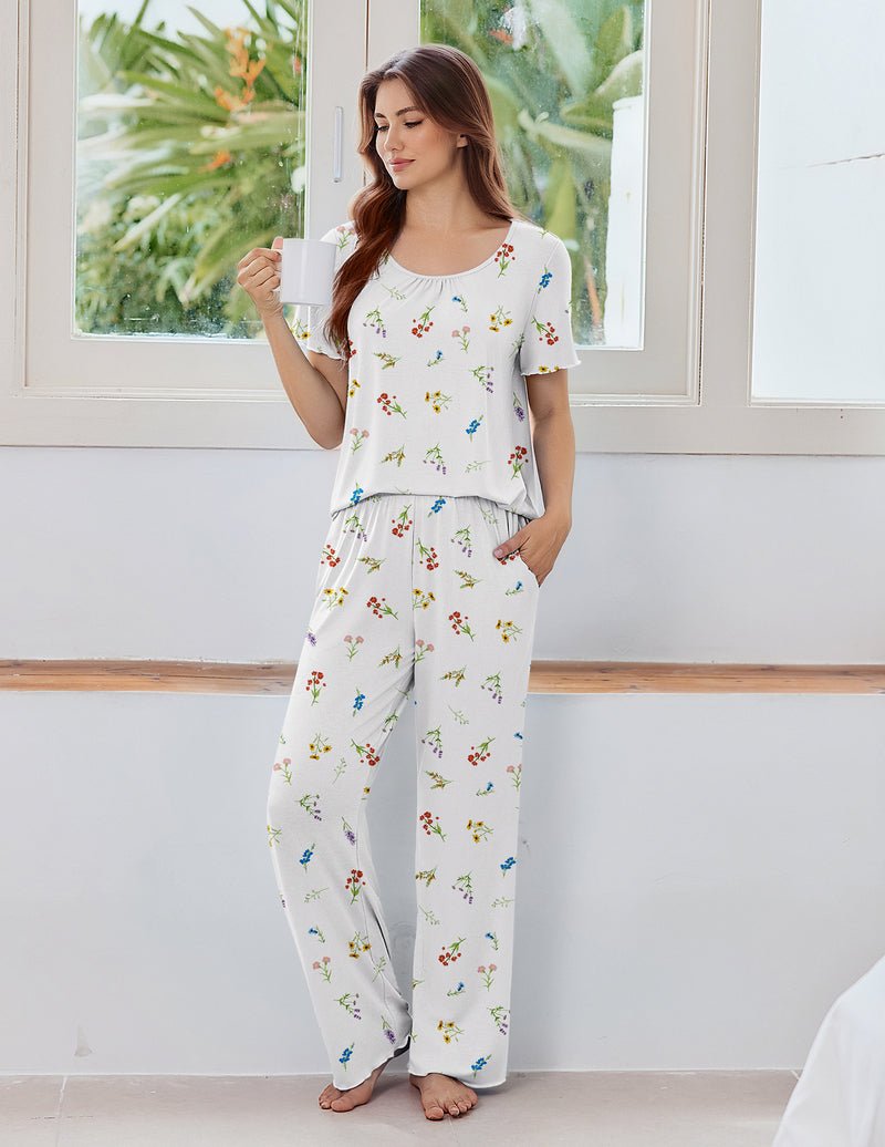 White pajama set with colorful print: short-sleeve top and wide-leg pants