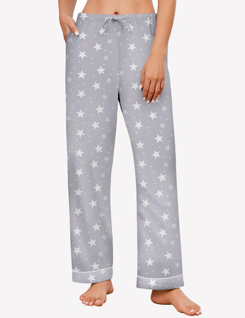 Light grey pajama pants with white stars, elastic drawstring waist, wide-leg style