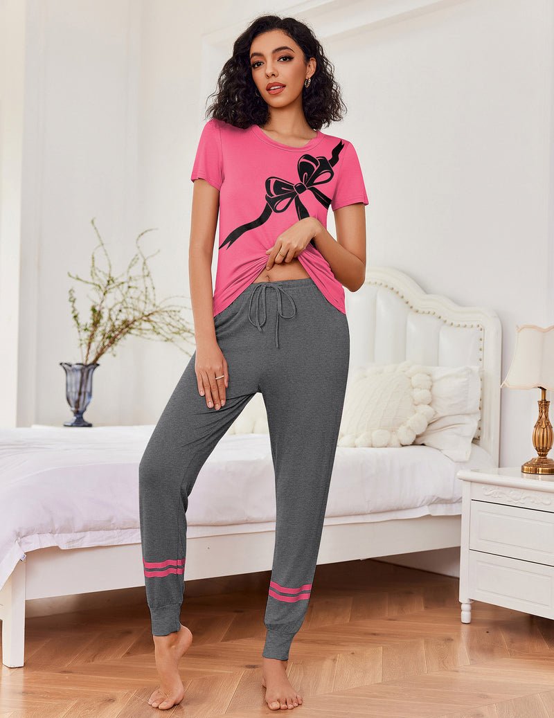 Rosa 2-teiliger Pyjama-Set mit Schleifen-Print: T-Shirt und dunkelgraue Hose mit roten Streifen