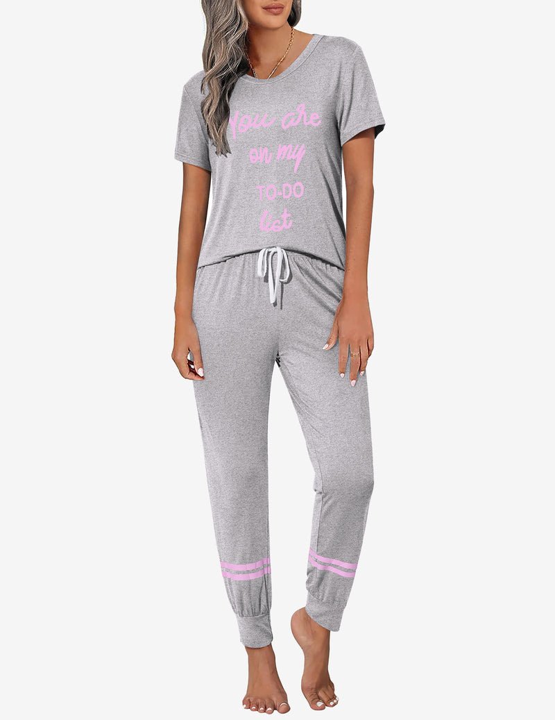 Heather grey 2-piece pajama set with pink “Goodnight” text, drawstring pants.