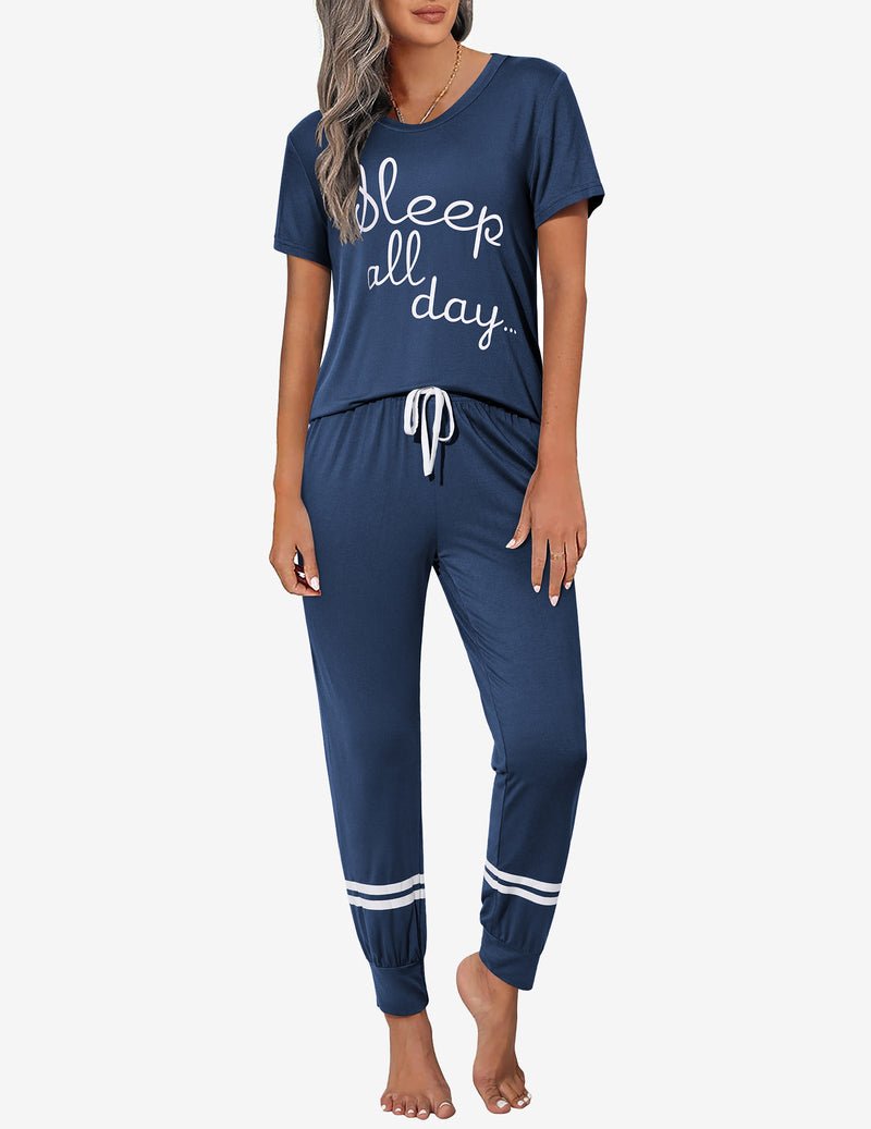 Navy blue 2-piece pajama set with “Sleep all day” graphic, drawstring waist joggers.