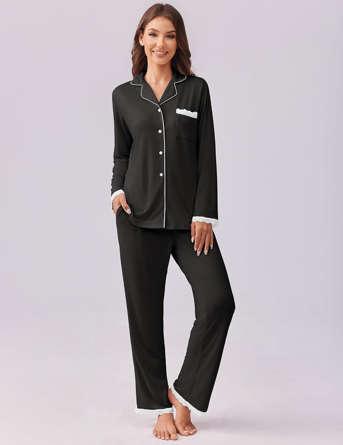 Black pajama set: long-sleeve button-down top with side pocket and matching pants.