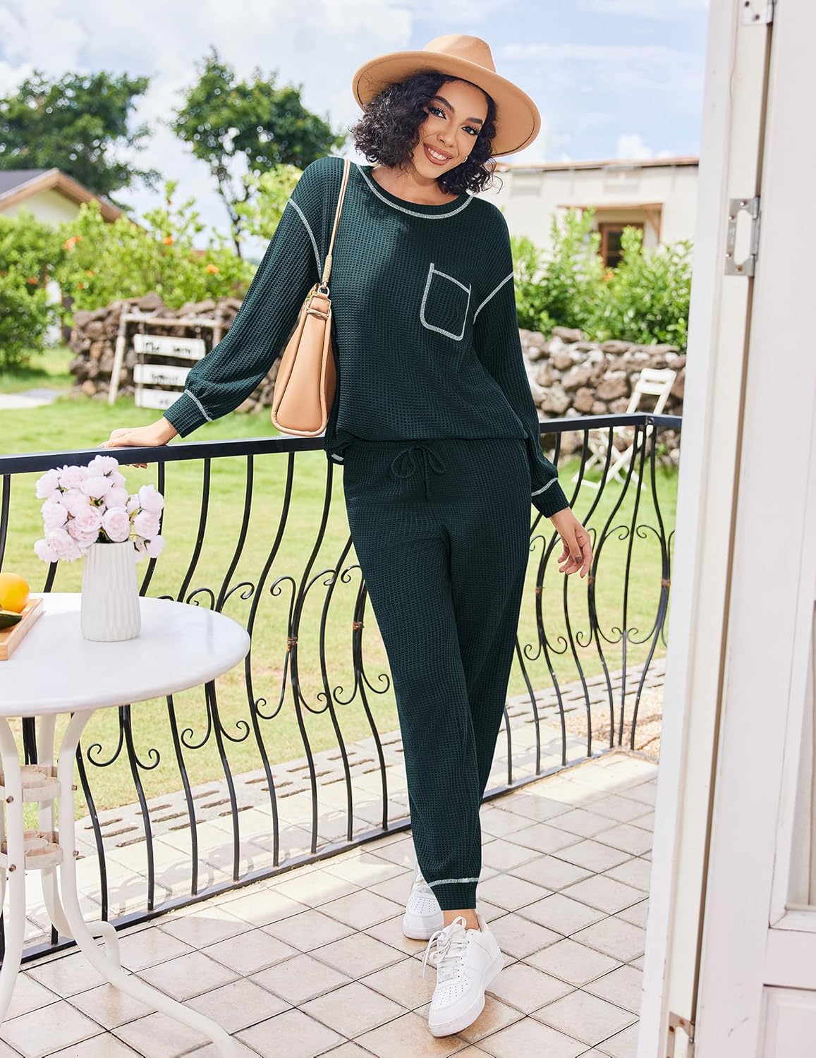 Dark green waffle-knit pajama set with long sleeves, contrast piping, and cuffed legs