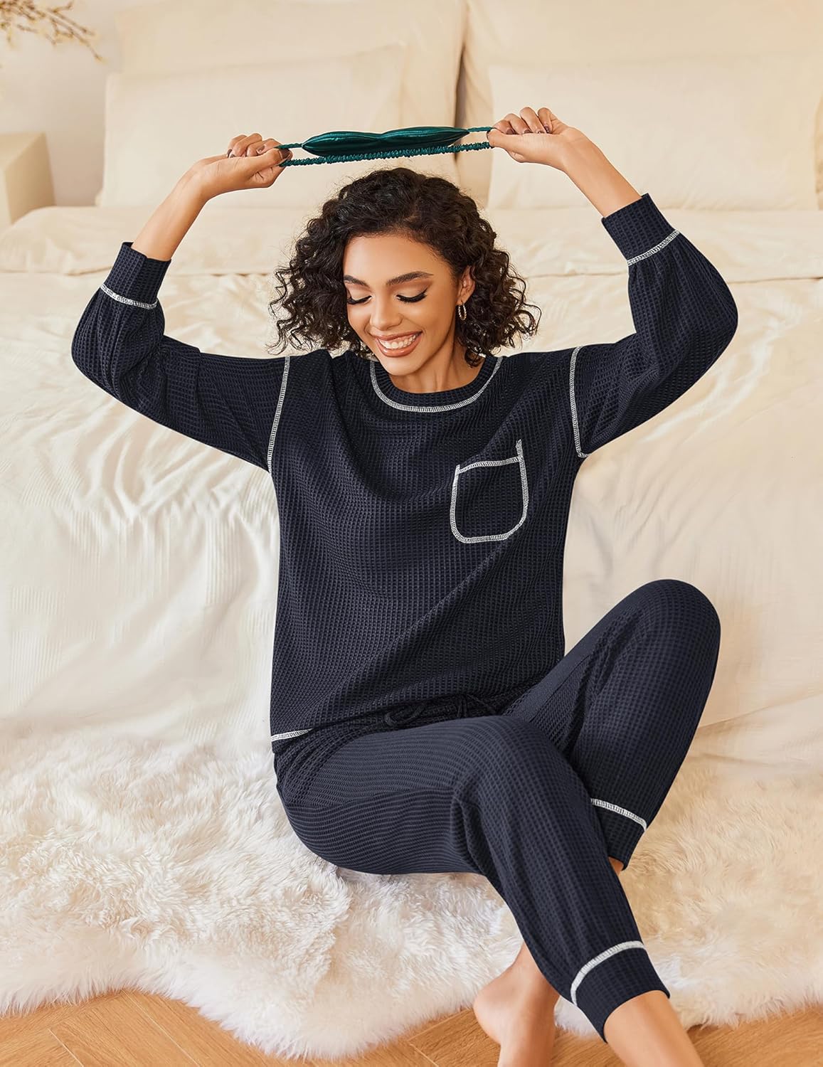 Dark navy waffle-knit pajama set, long sleeves and pants with white contrast trim