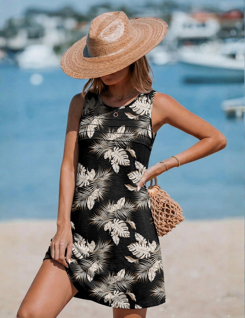 Black sleeveless tank dress coverup with pleated front and white tropical leaf print