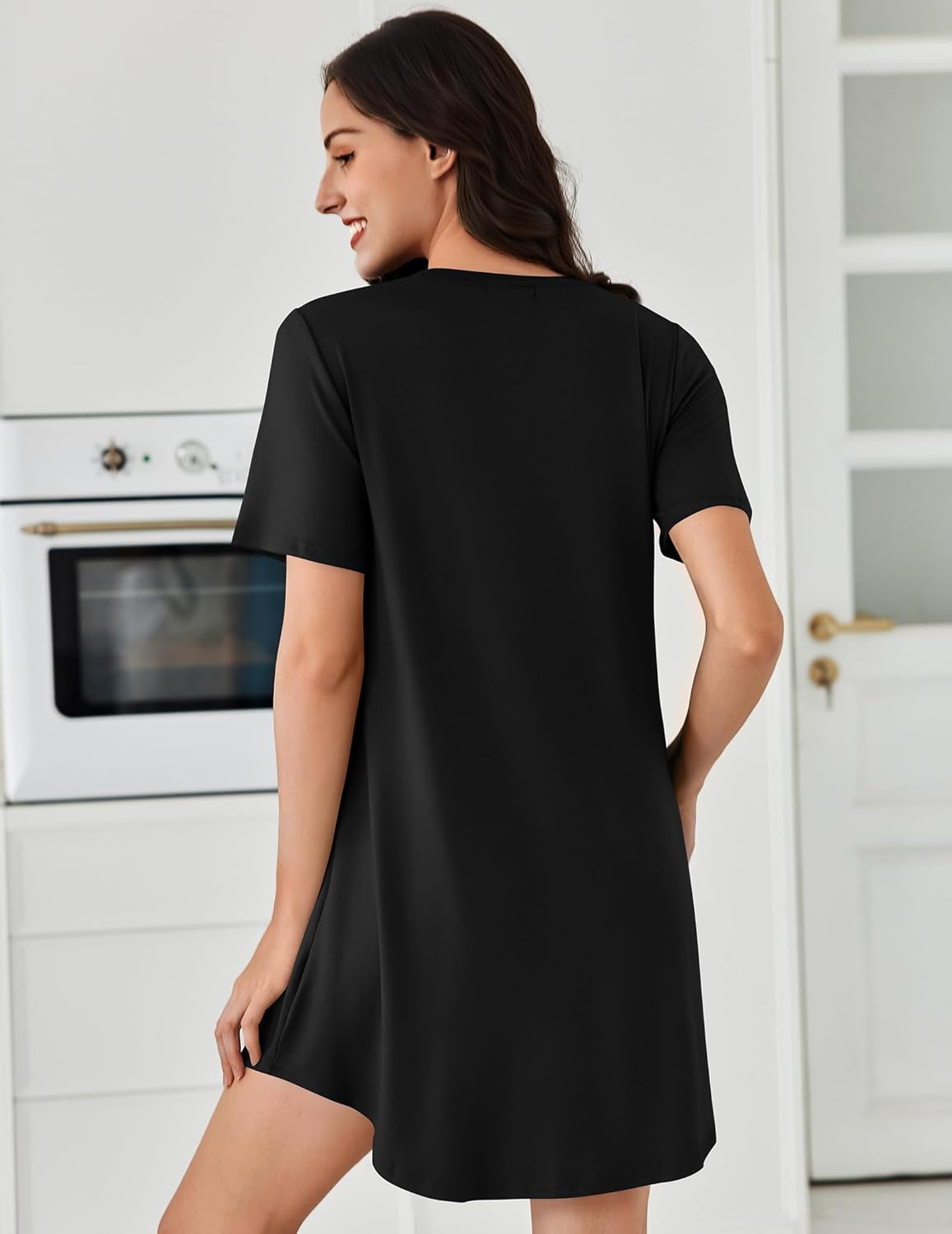 Pleated short-sleeve sleepdress in solid black, back view, round neckline