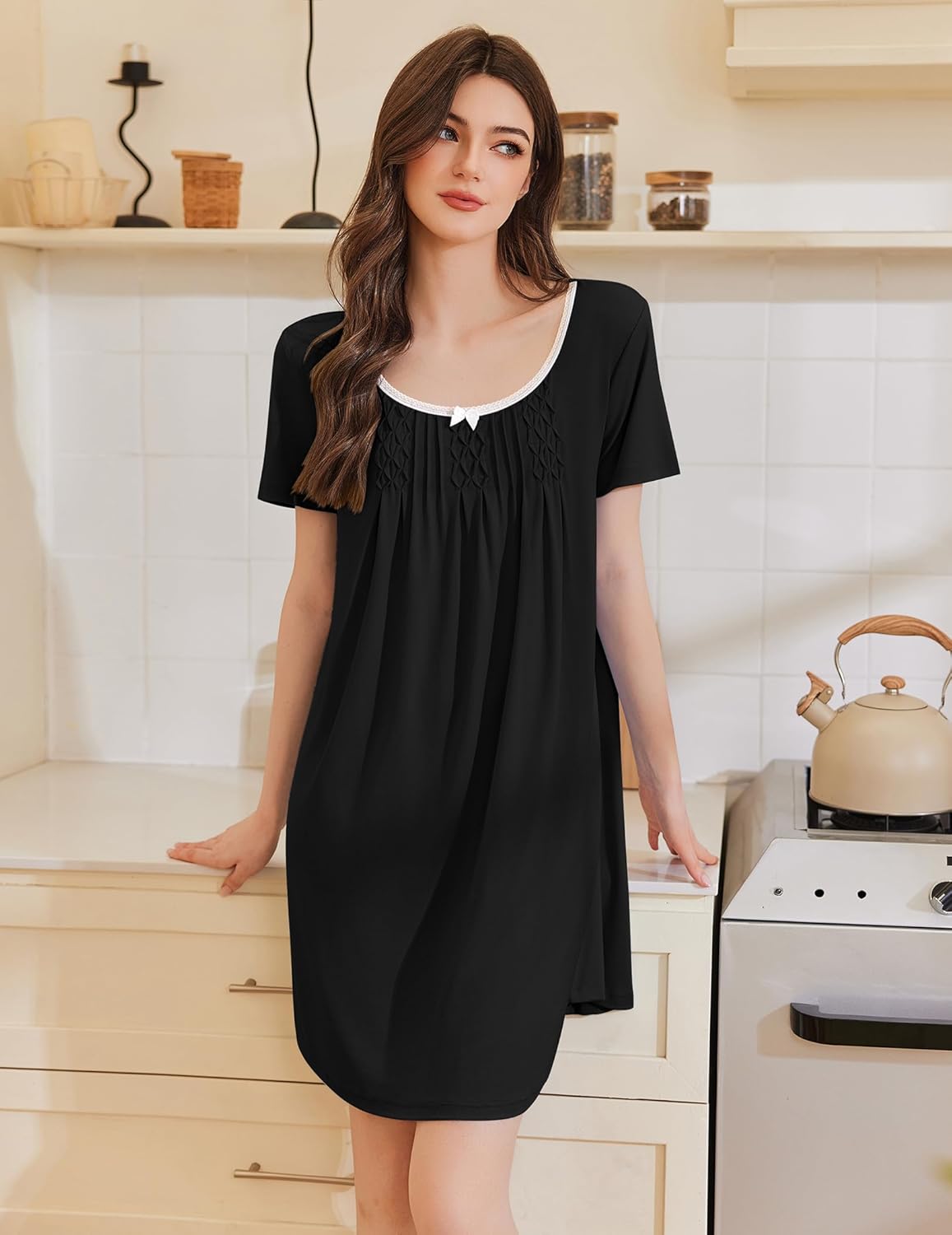 Black pleated short-sleeve nightshirt with white-trim scoop neckline and pintucks