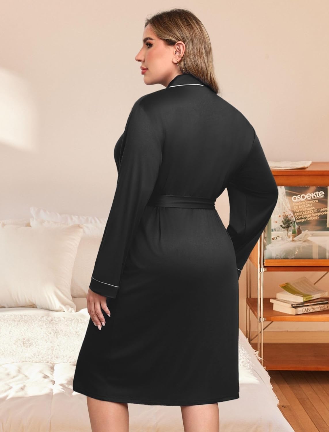 Black bathrobe back view with waist belt and long sleeves, contrast piping
