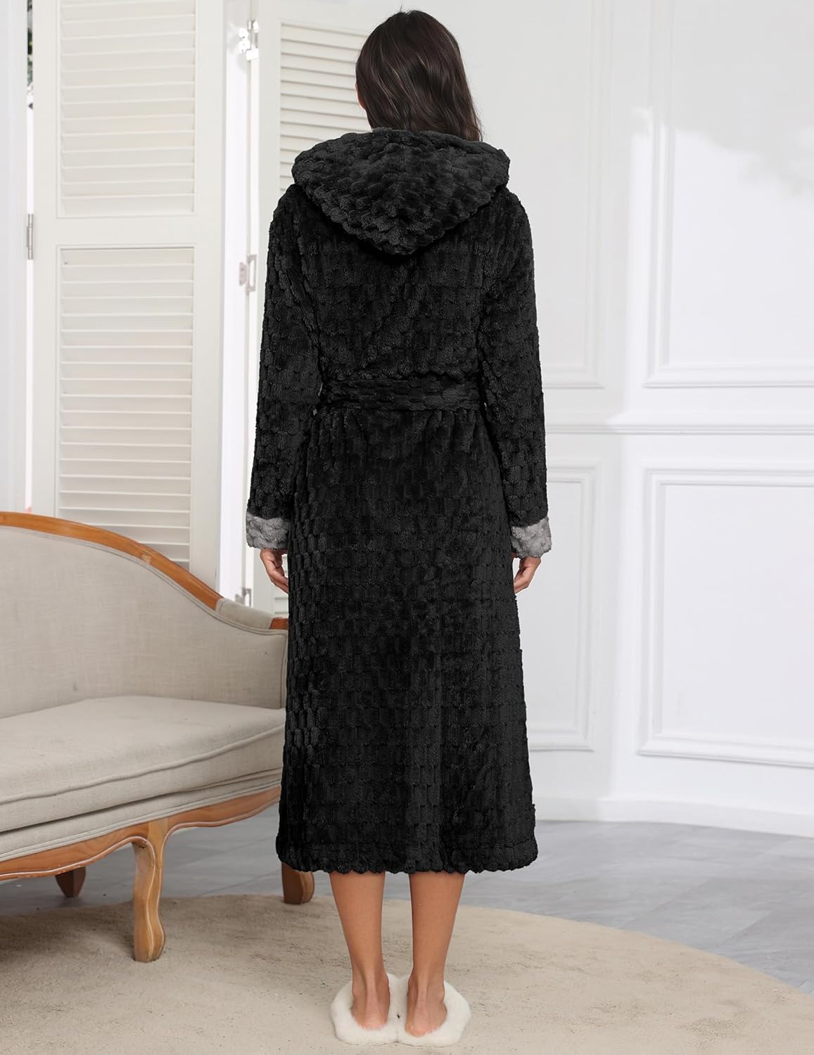 Long black hooded robe with tie waist, quilted-looking jacquard texture and full sleeves