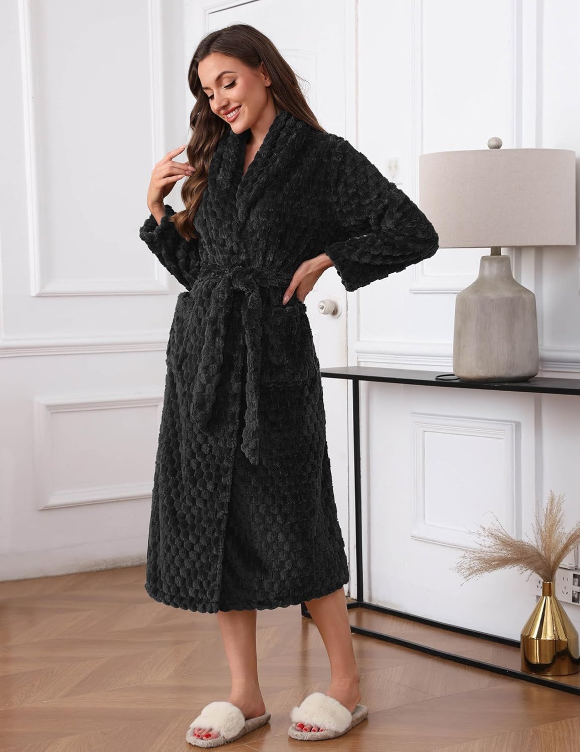Black plush bathrobe with textured waffle weave, belt tie, shawl collar