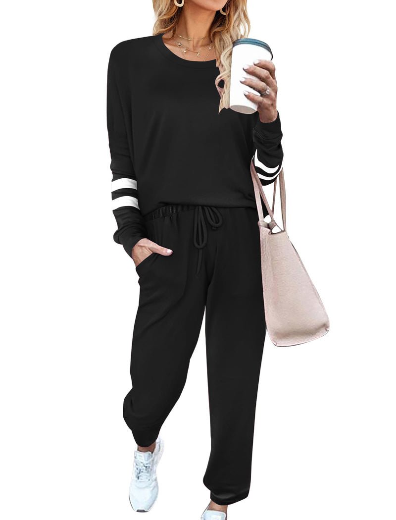 Black 2-piece pajama set with long sleeves, striped cuffs, relaxed drawstring pants