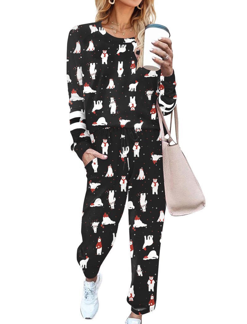 Black long-sleeve pajama set with penguin reindeer print and drawstring jogger pants
