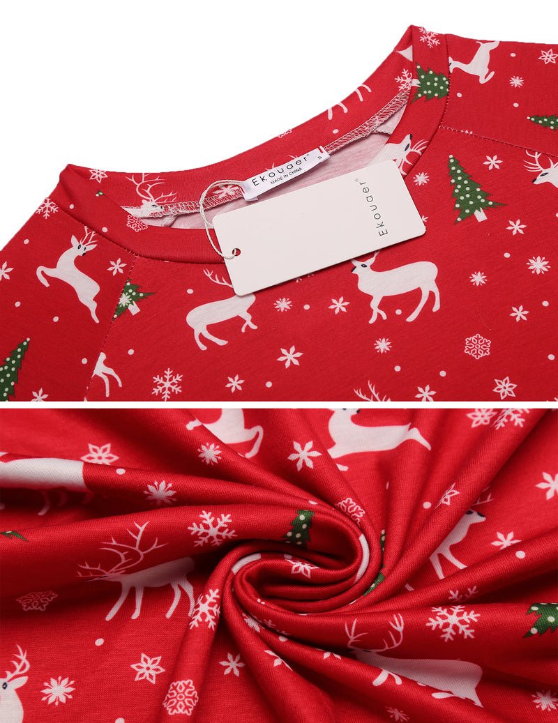 Red printed pajama fabric close-up with reindeer, snowflakes, and tags on collar