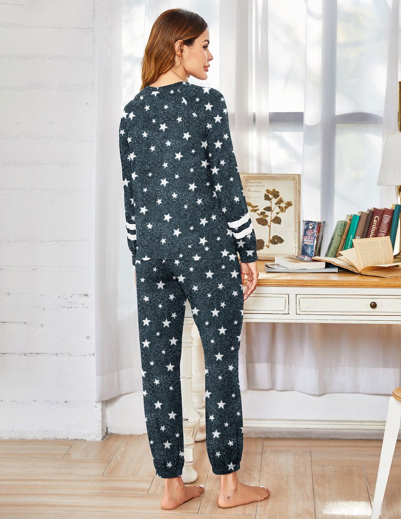 Back view: navy star-print long-sleeve pajama set with drawstring jogger pants