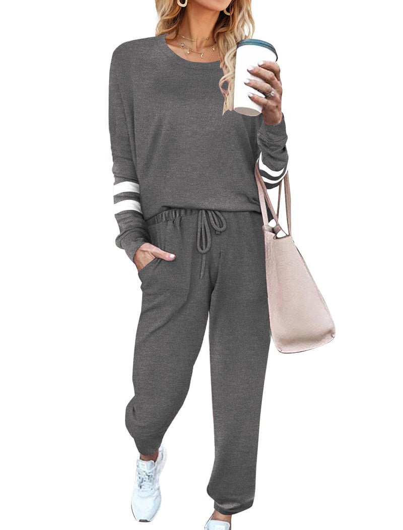 Charcoal grey pajama set with long sleeves, striped cuffs, and drawstring jogger pants