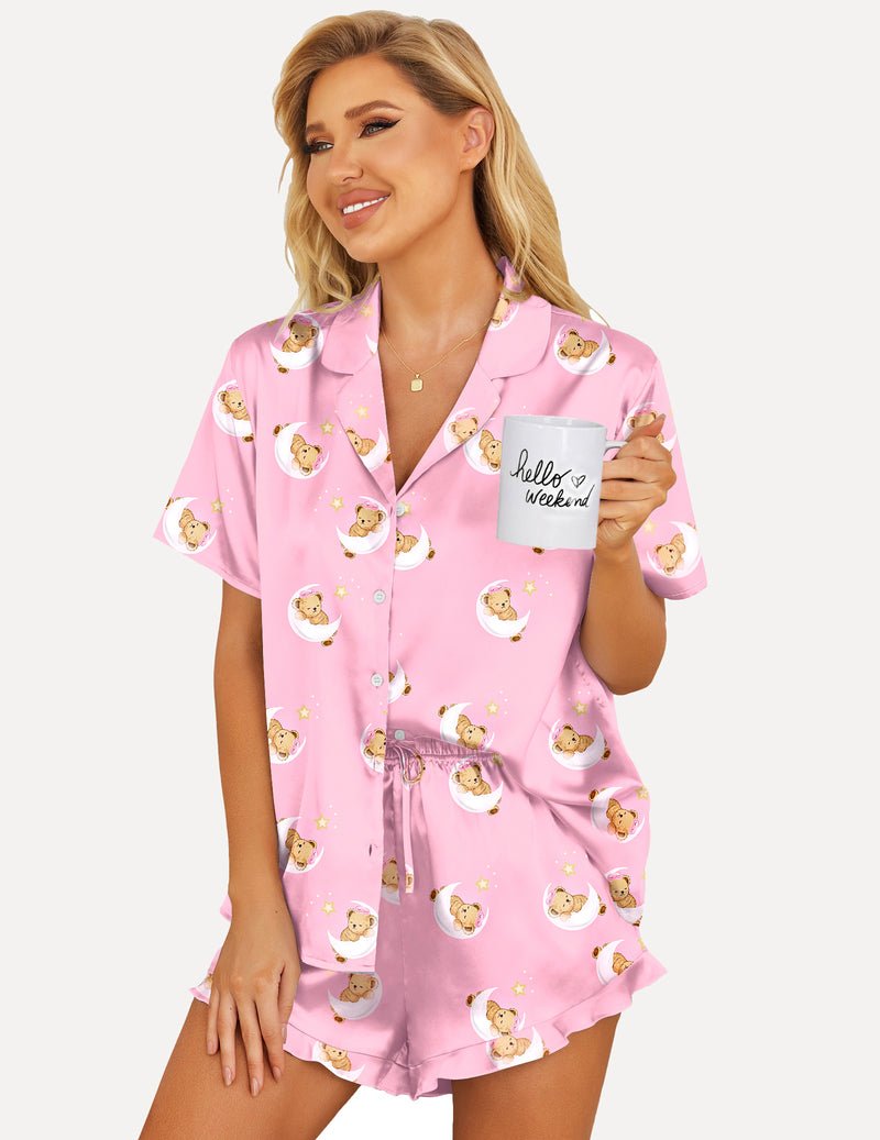Printed satin pajama set, pink with teddy bear faces, button-up top and ruffled shorts