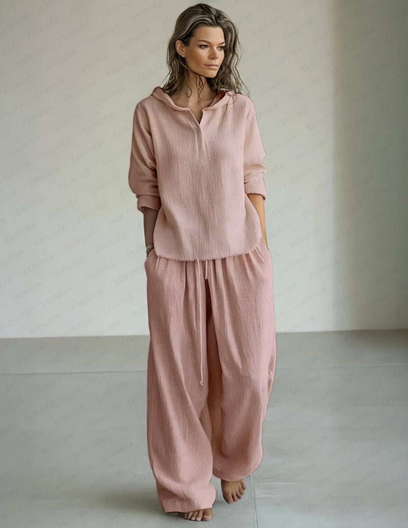 Pink lounge set: hooded pullover and relaxed drawstring pants with cuffed hem.