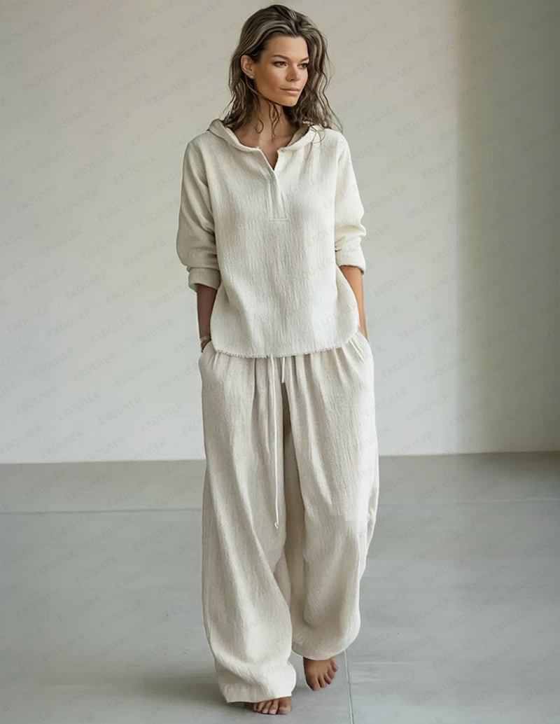 White lounge set: hooded pullover with half placket and loose drawstring pants.